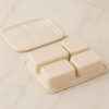 Bottom view of four compartment cornstarch container with structured molded base
