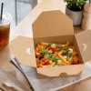 1400ml kraft takeaway box serving pasta in a bright café table setting