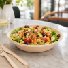 680ml bagasse bowl serving grilled shrimp salad in cafe setting